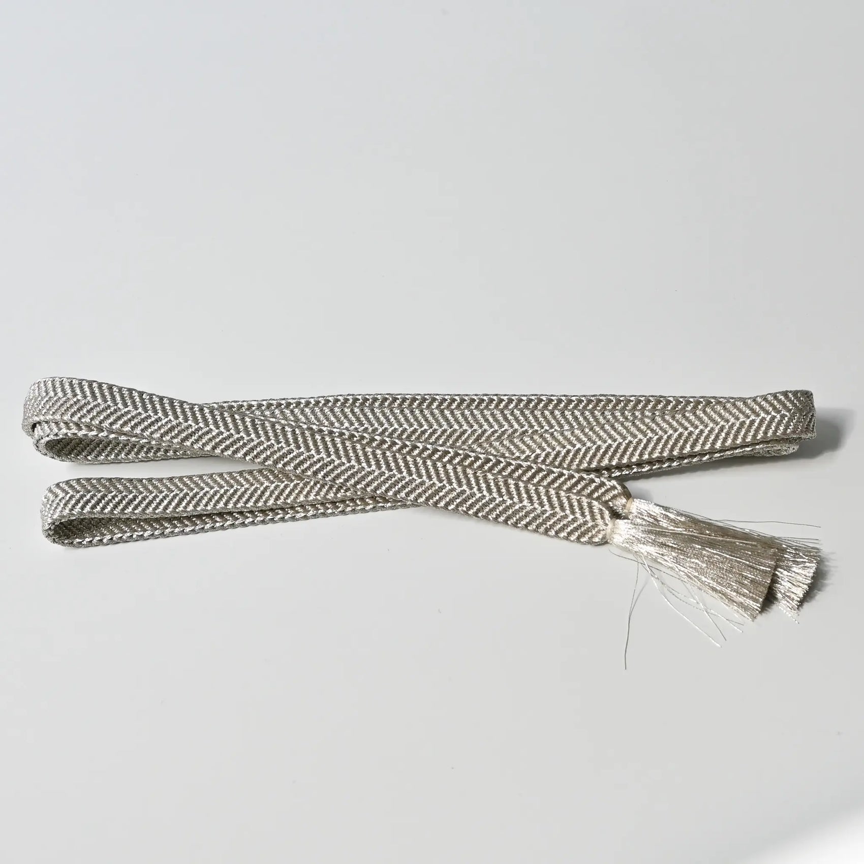 Vintage/recycled women's kimono dress accessories, Obijime cord in metallic silver.