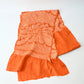 Recycled persimmon orange silk shibori oblige with chrysanthemum motif.