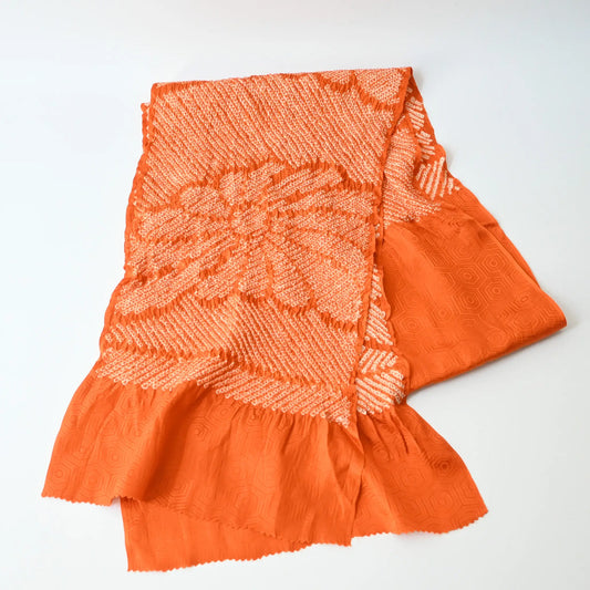 Recycled persimmon orange silk shibori oblige with chrysanthemum motif.