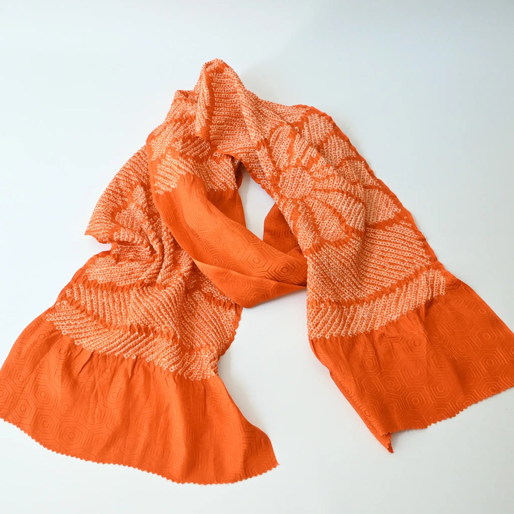 Recycled persimmon orange silk shibori oblige with chrysanthemum motif.