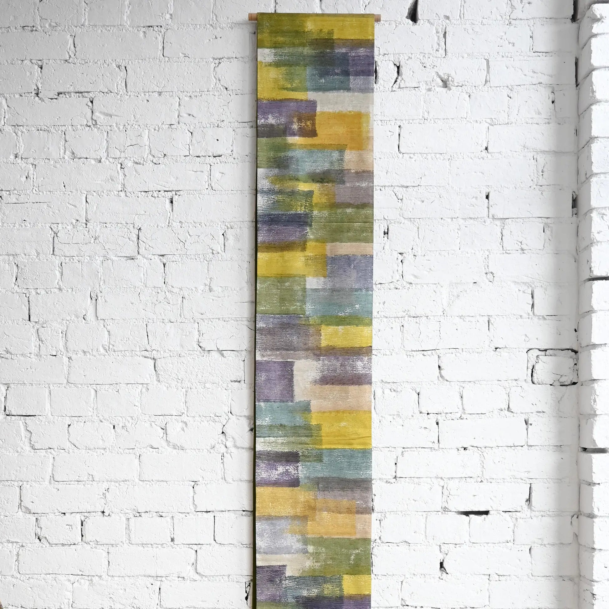 Hanging view of recycled women's tsumugi silk obi with dyed abstract painterly motif.