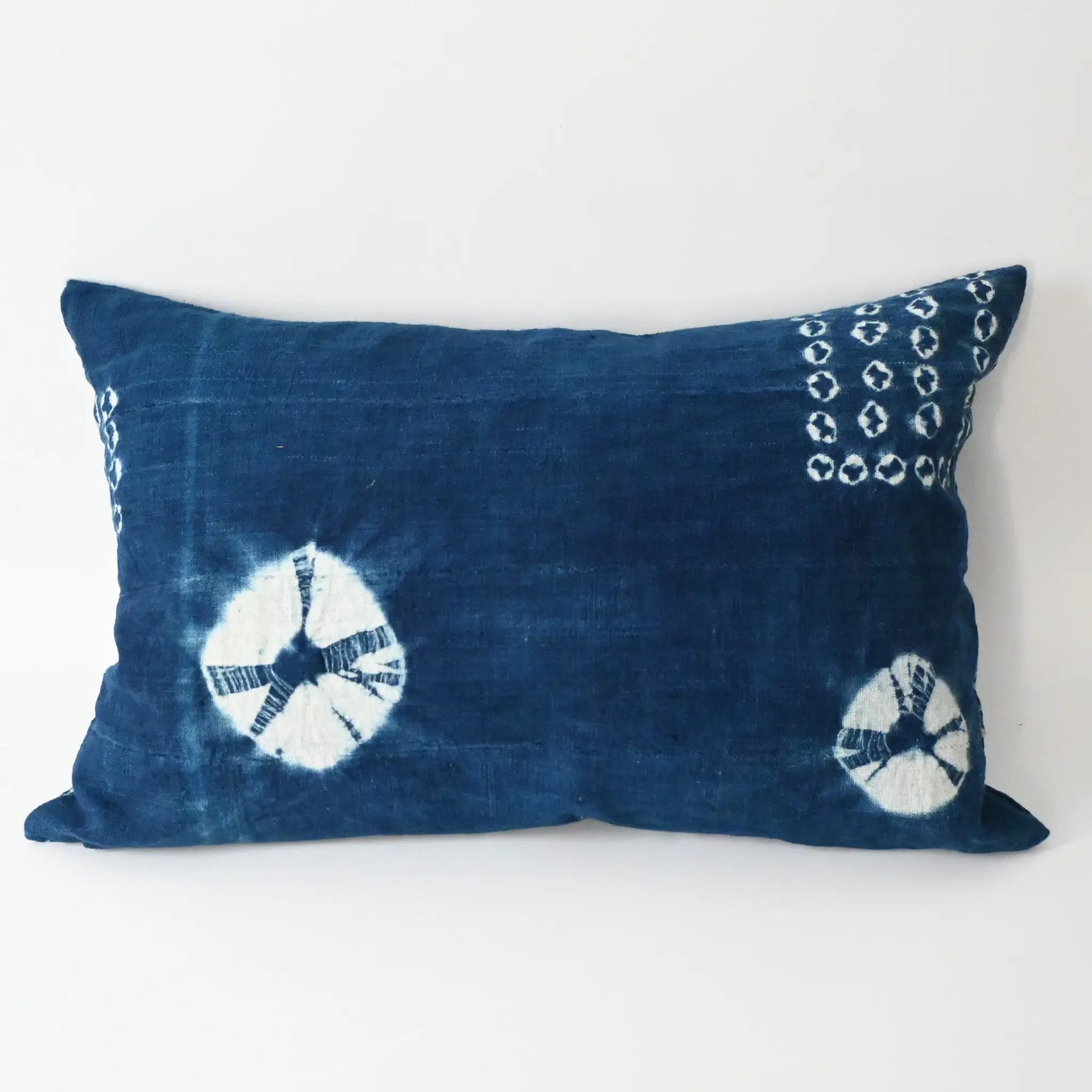 Handmade shibori indigo African mudcloth cushion with duck feather insert.