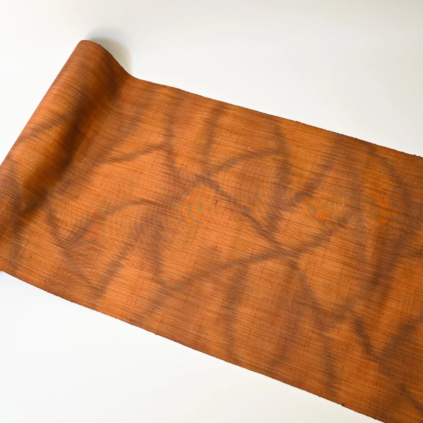 Full view of vintage amber brown tsumugi silk kimono fabric with abstract pattern, sold by the metre.