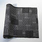 Vintage black silk kimono fabric roll with patchwork-style geometric pattern, sold by the metre.