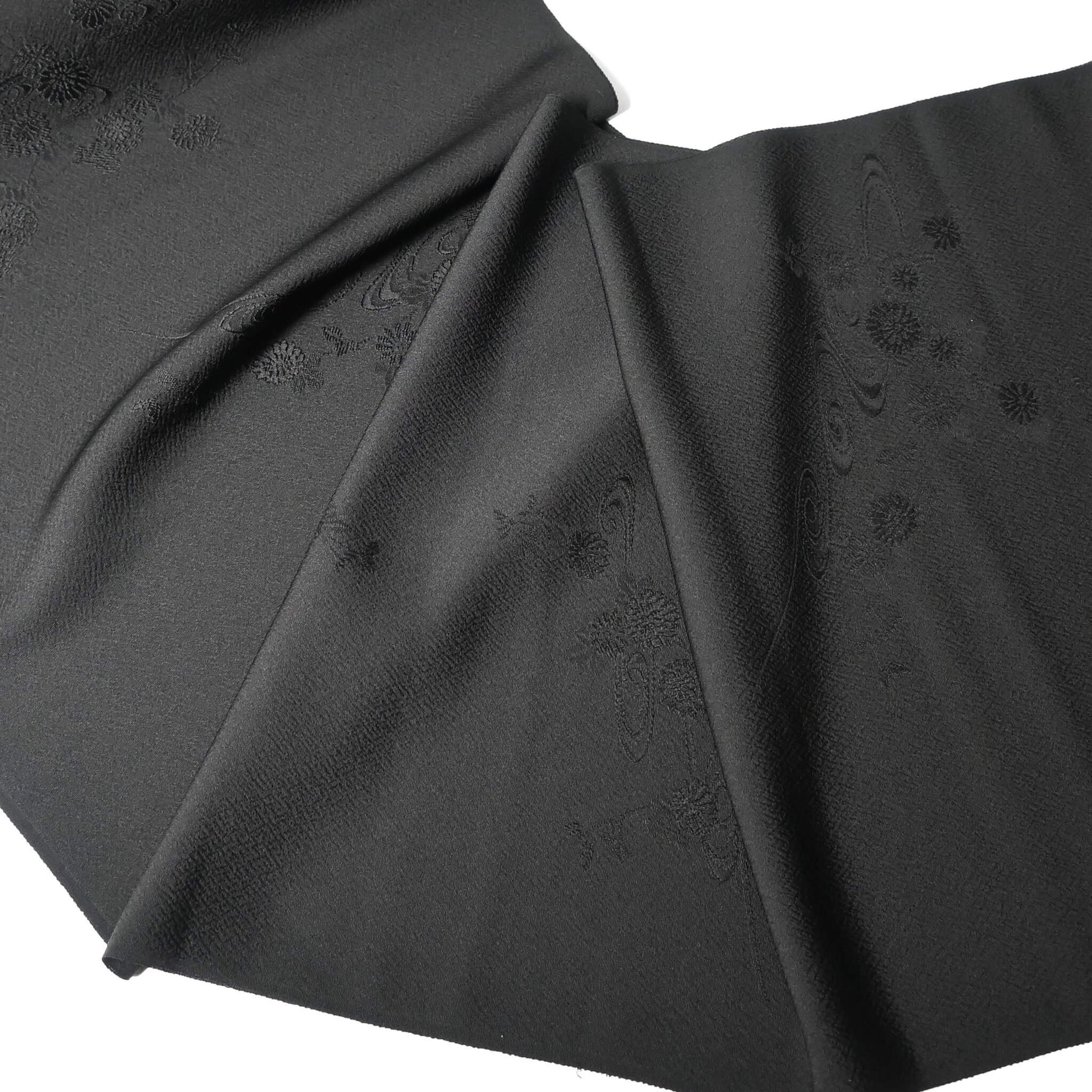 Vintage black silk jacquard kimono fabric with running water and chrysanthemum motifs, drape well.