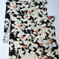 Vintage women's silk kimono fabric piece in black with plum blossom design.