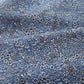 Detailed view of vintage blue heavy silk crepe kimono fabric with katazome dyed small floral pattern.