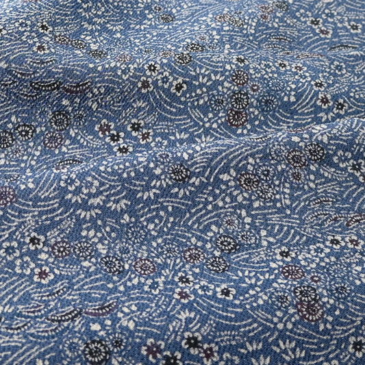 Detailed view of vintage blue heavy silk crepe kimono fabric with katazome dyed small floral pattern.