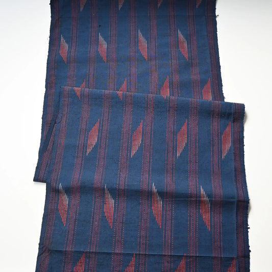 Full view of vintage Japanese blue tsumugi silk kimono fabric piece with red line pattern.