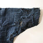 Detailed view of vintage Japanese Boro indigo cotton Noragi from the early to mid-20th century.