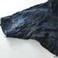 Detailed view of vintage Japanese Boro indigo cotton Noragi from the early to mid-20th century.