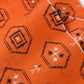 Detailed view of vintage bright tsumugi silk kimono fabric roll with black Kikko motif.