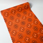 Full view of vintage bright tsumugi silk kimono fabric roll with black Kikko motif.