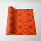 Vintage bright tsumugi silk kimono fabric roll with black Kikko motif.