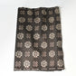 Vintage Japanese silk kimono fabric in rich dark brown with kasuri woven pattern.