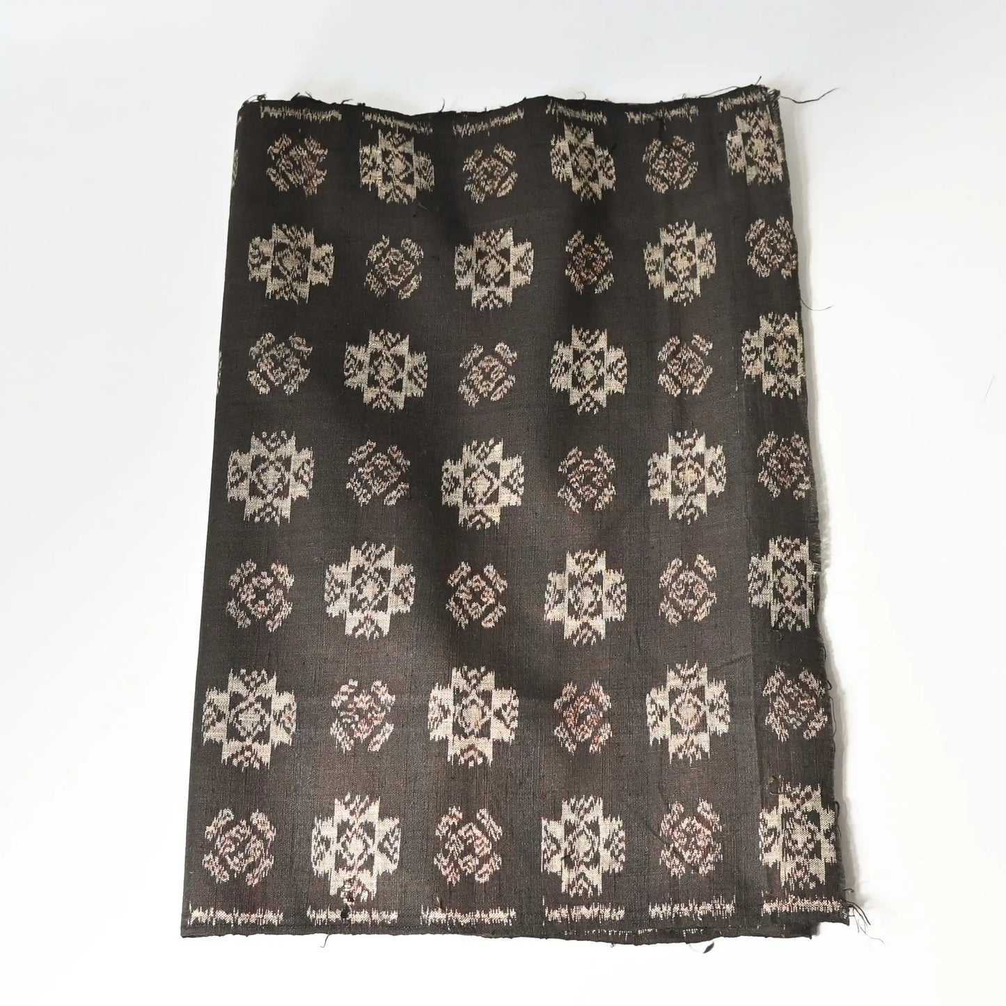 Vintage Japanese silk kimono fabric in rich dark brown with kasuri woven pattern.