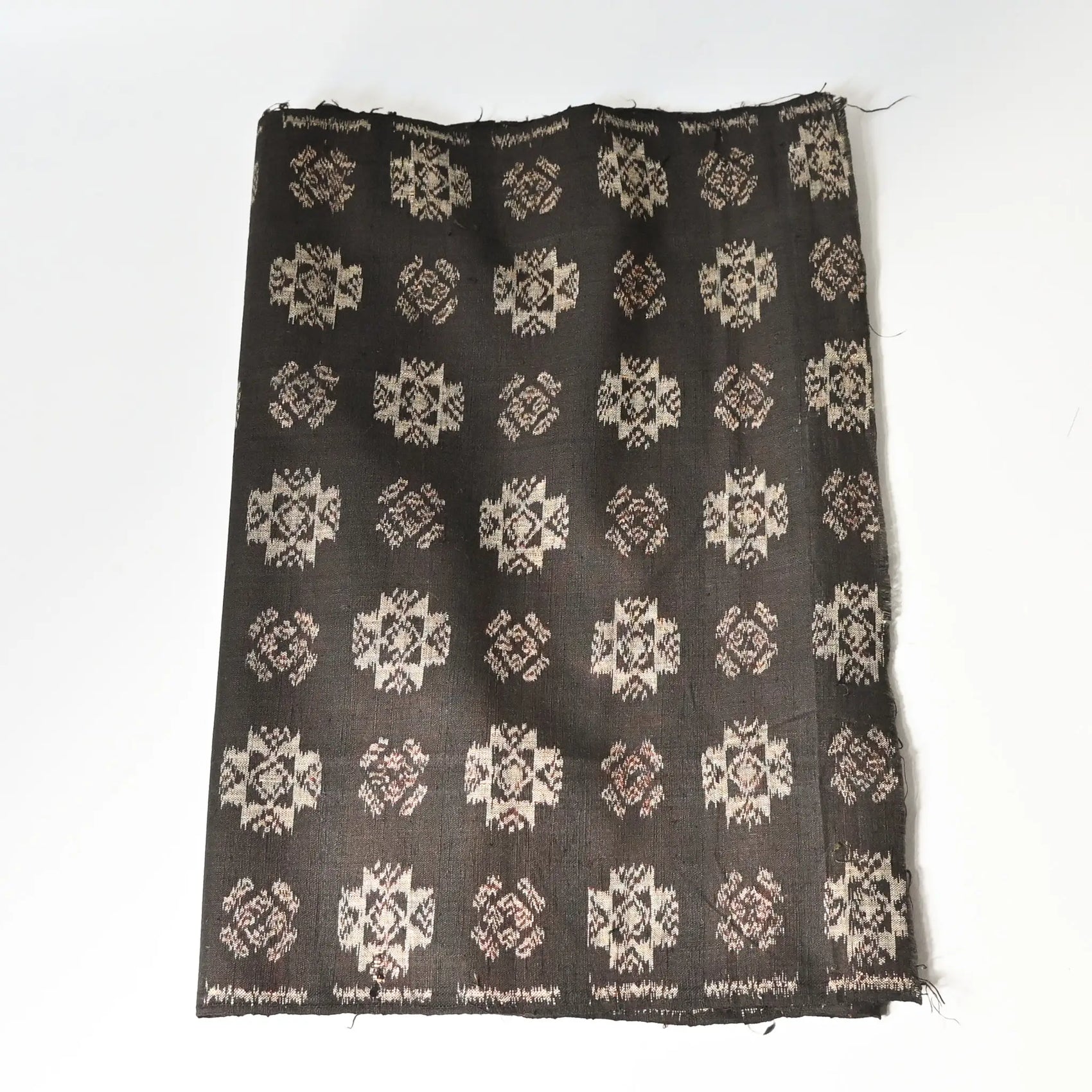 Vintage Japanese silk kimono fabric in rich dark brown with kasuri woven pattern.