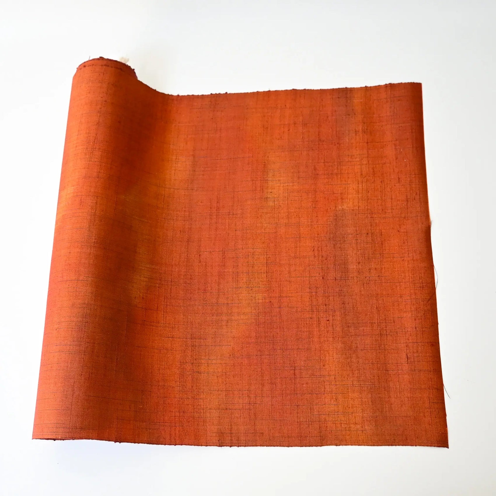 Vintage burnt orange tsumugi silk kimono fabric roll sold by the metre.