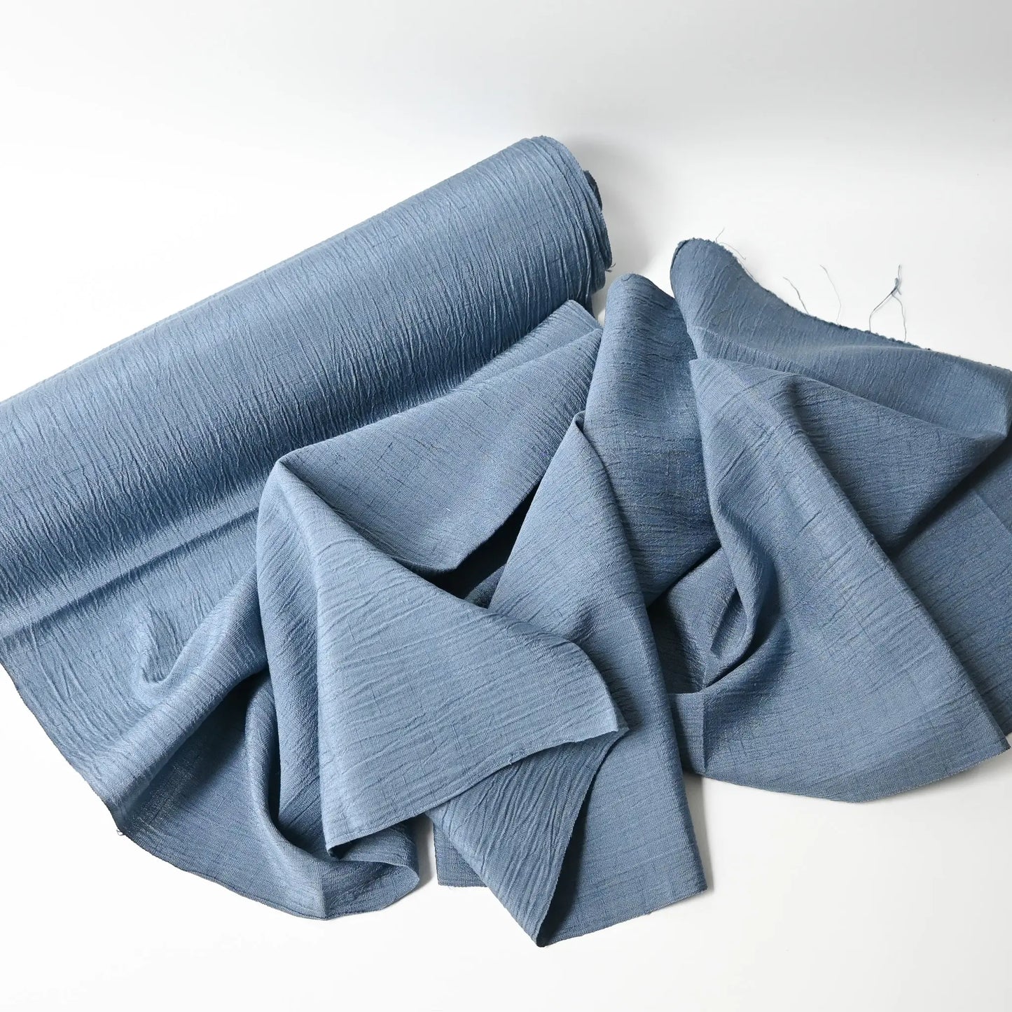 Full view of vintage calm blue grey tone silk kimono fabric with distinctive texture, sold by the metre.