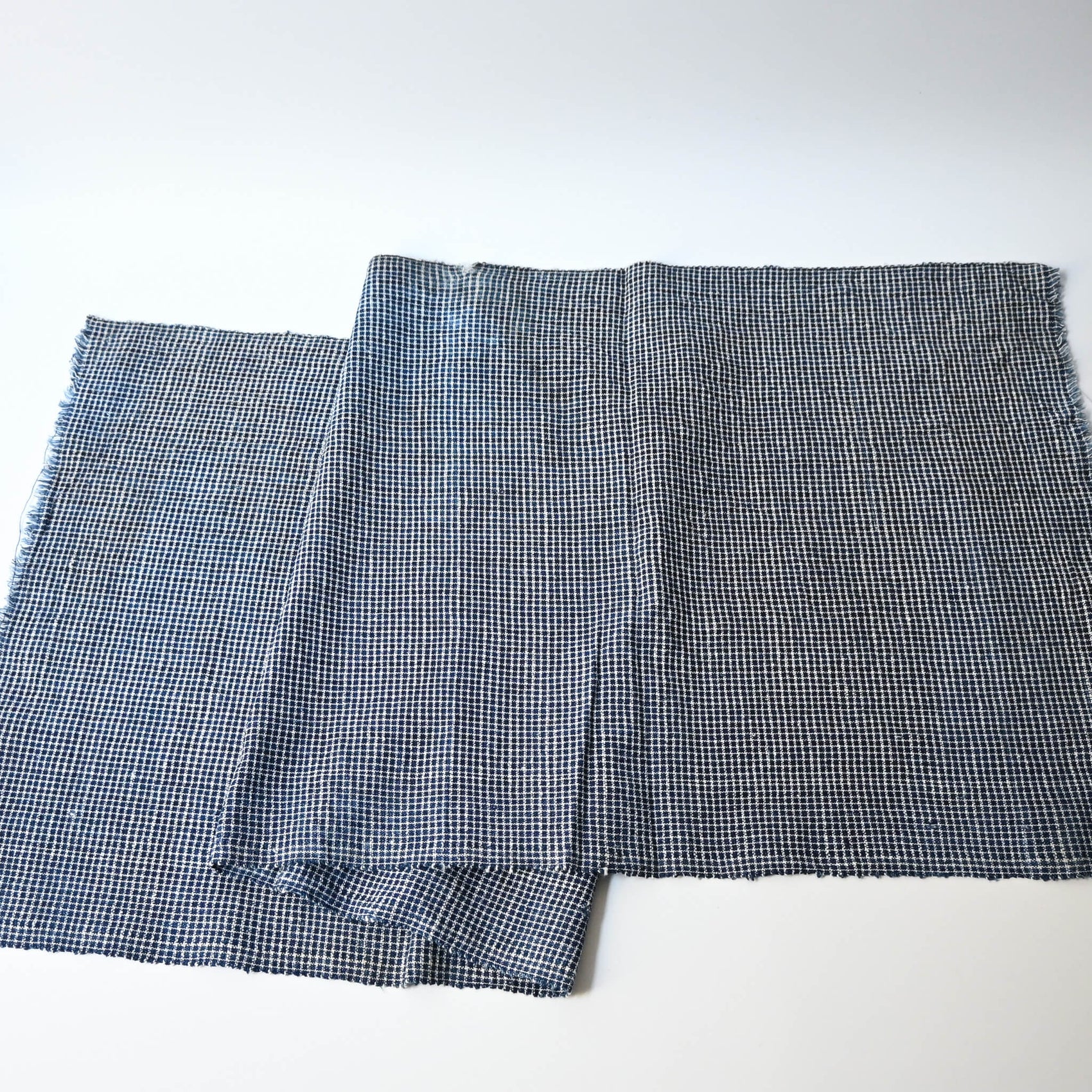 Full view of vintage Chinese hand loomed indigo check cotton piece.