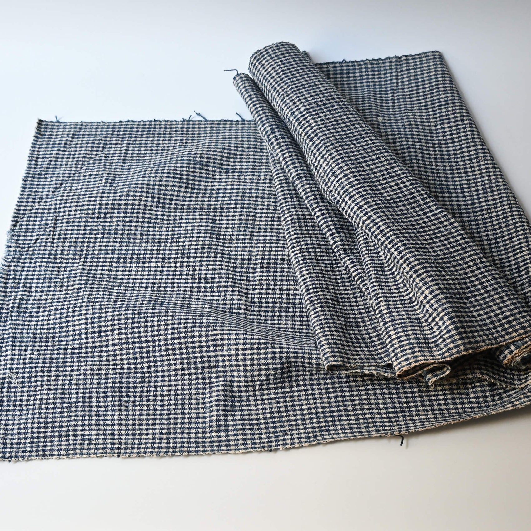 Vintage Chinese indigo cotton with small check pattern, suitable for soft furnishings.