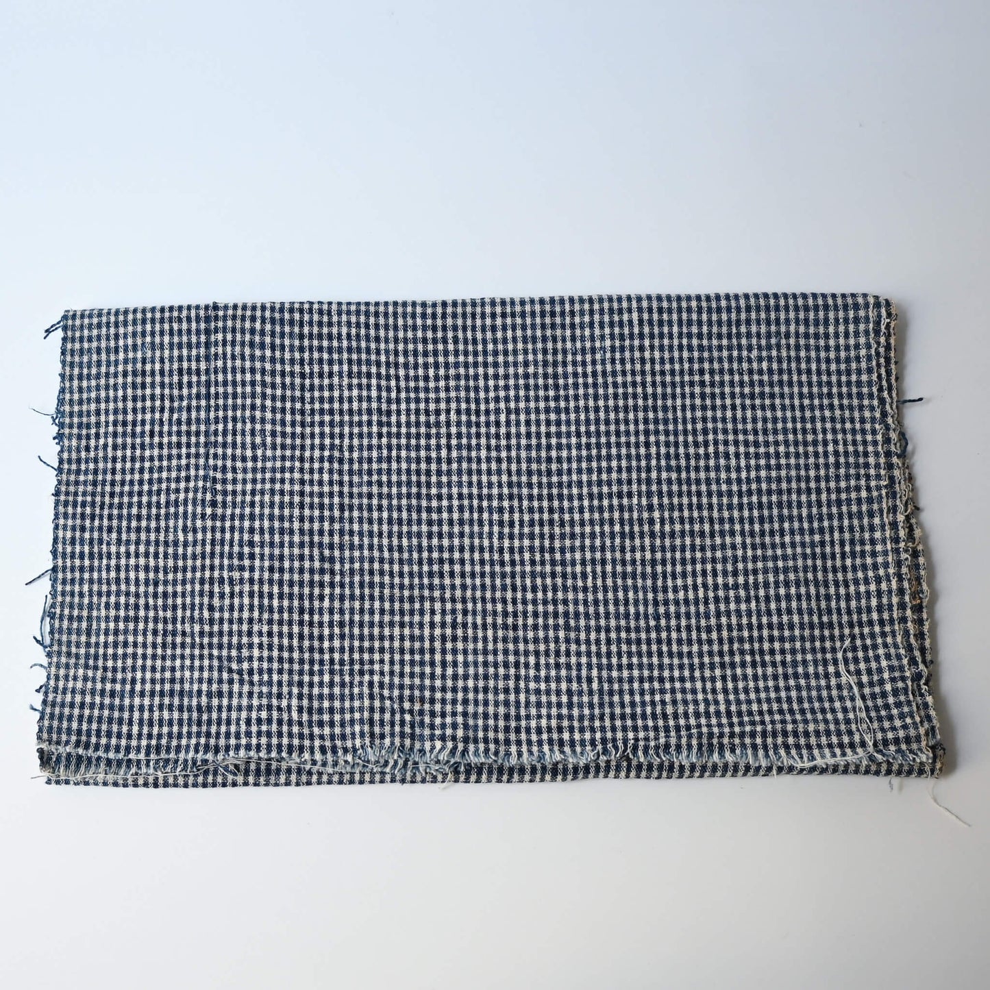 Vintage Chinese indigo cotton with small check pattern, suitable for soft furnishings.