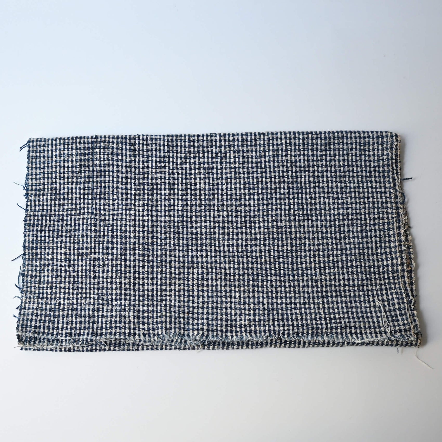 Vintage Chinese indigo cotton with small check pattern, suitable for soft furnishings.