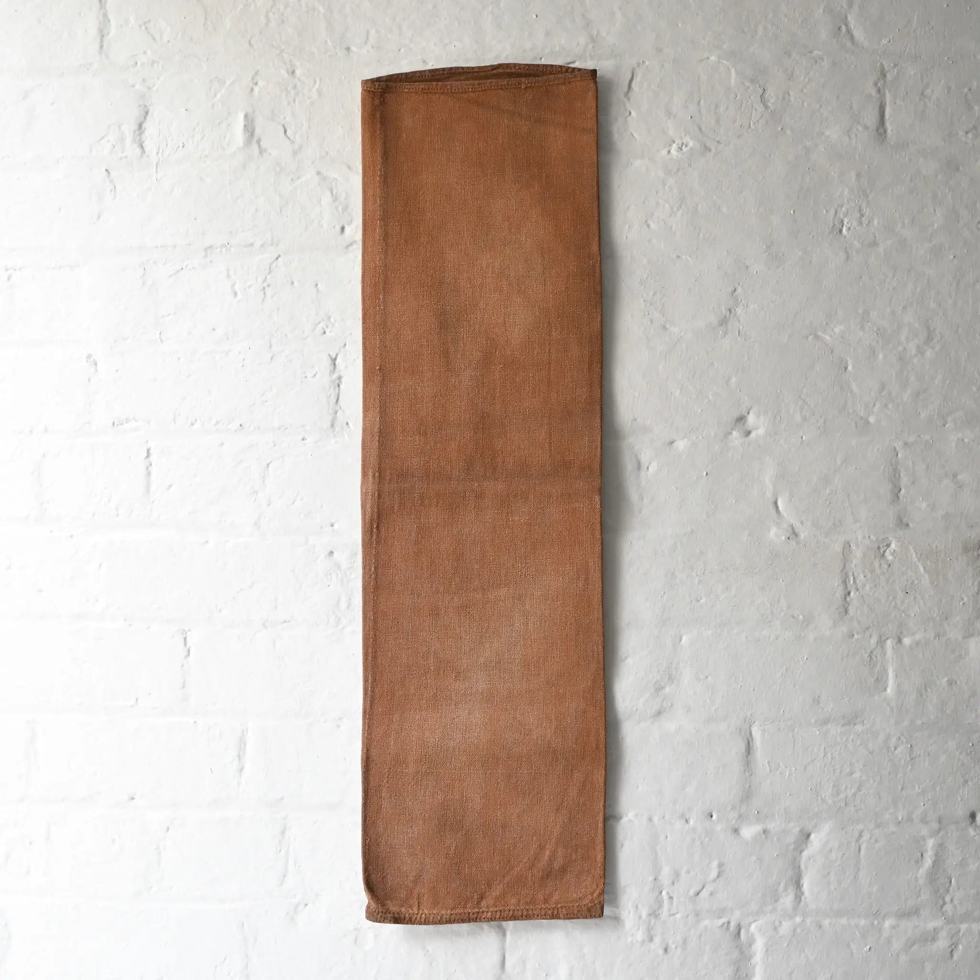 Full view of vintage heavy cotton sake bag called Sakabukuro, dyed with kakishibu fermented persimmon juice.