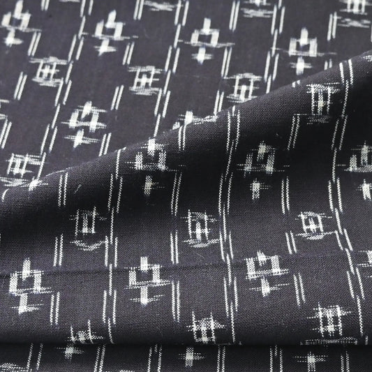 Detailed view of vintage Japanese dark navy kasuri kimono fabric cotton.