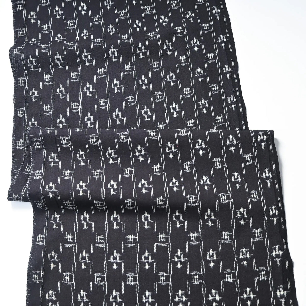 Full view of vintage Japanese dark navy kasuri kimono fabric cotton.