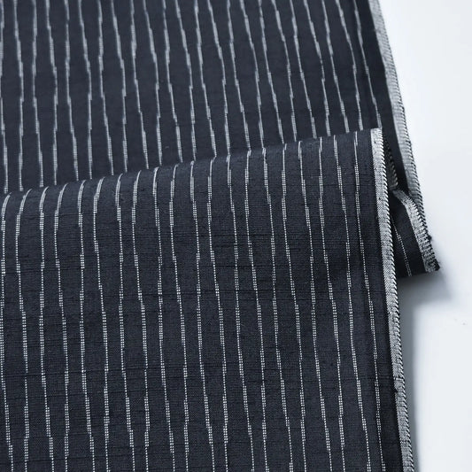 Detailed view of vintage Japanese dark navy Yoroke-jima stripe Tsumugi silk kimono fabric.