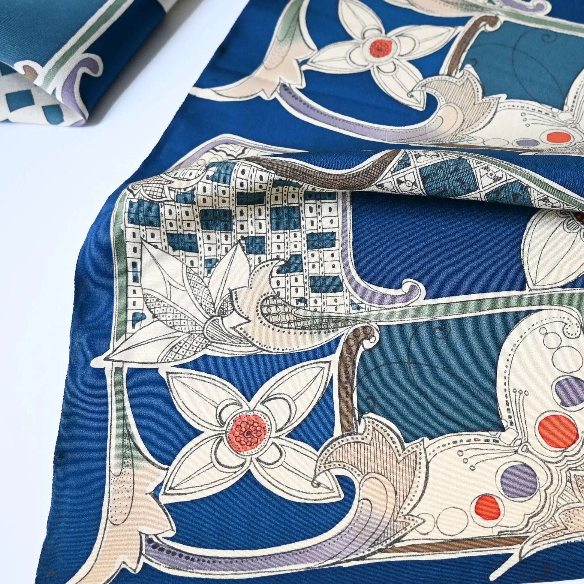 Close-up view of rare vintage deep blue silk kimono fabric with modern European-inspired design.