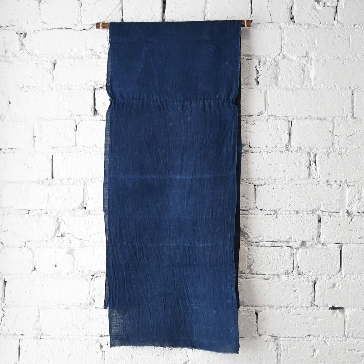 Full view of vintage Japanese slightly open weave cotton dyed in deep indigo blue.