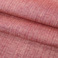 Close-up view of vintage dusty pink tsumugi silk kimono fabric sold by the metre.