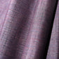 Close-up view of vintage dusty purple tsumugi silk kimono fabric sold by the metre.