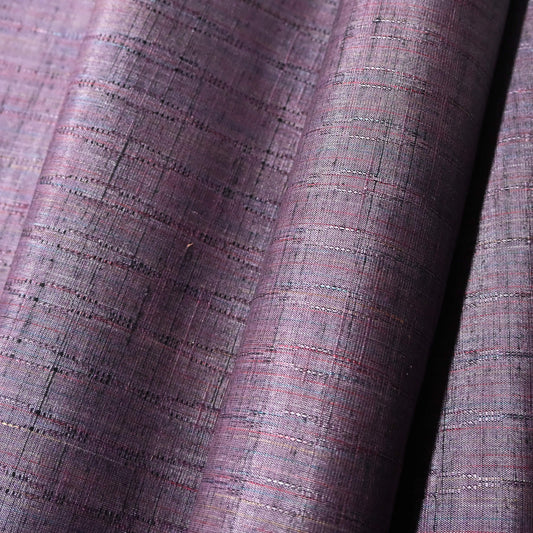 Close-up view of vintage dusty purple tsumugi silk kimono fabric sold by the metre.