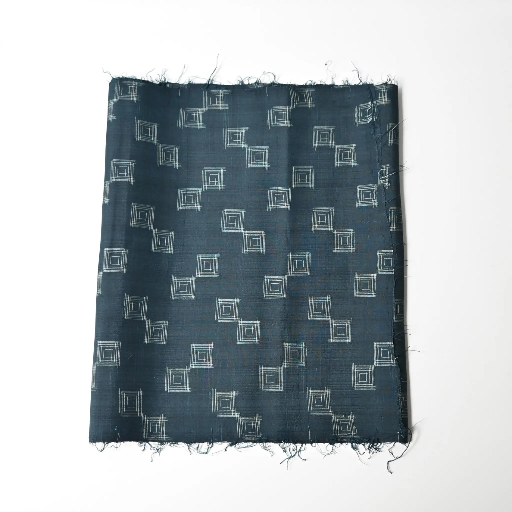 Vintage fine silk kimono fabric piece in dark emerald green with simple square pattern.