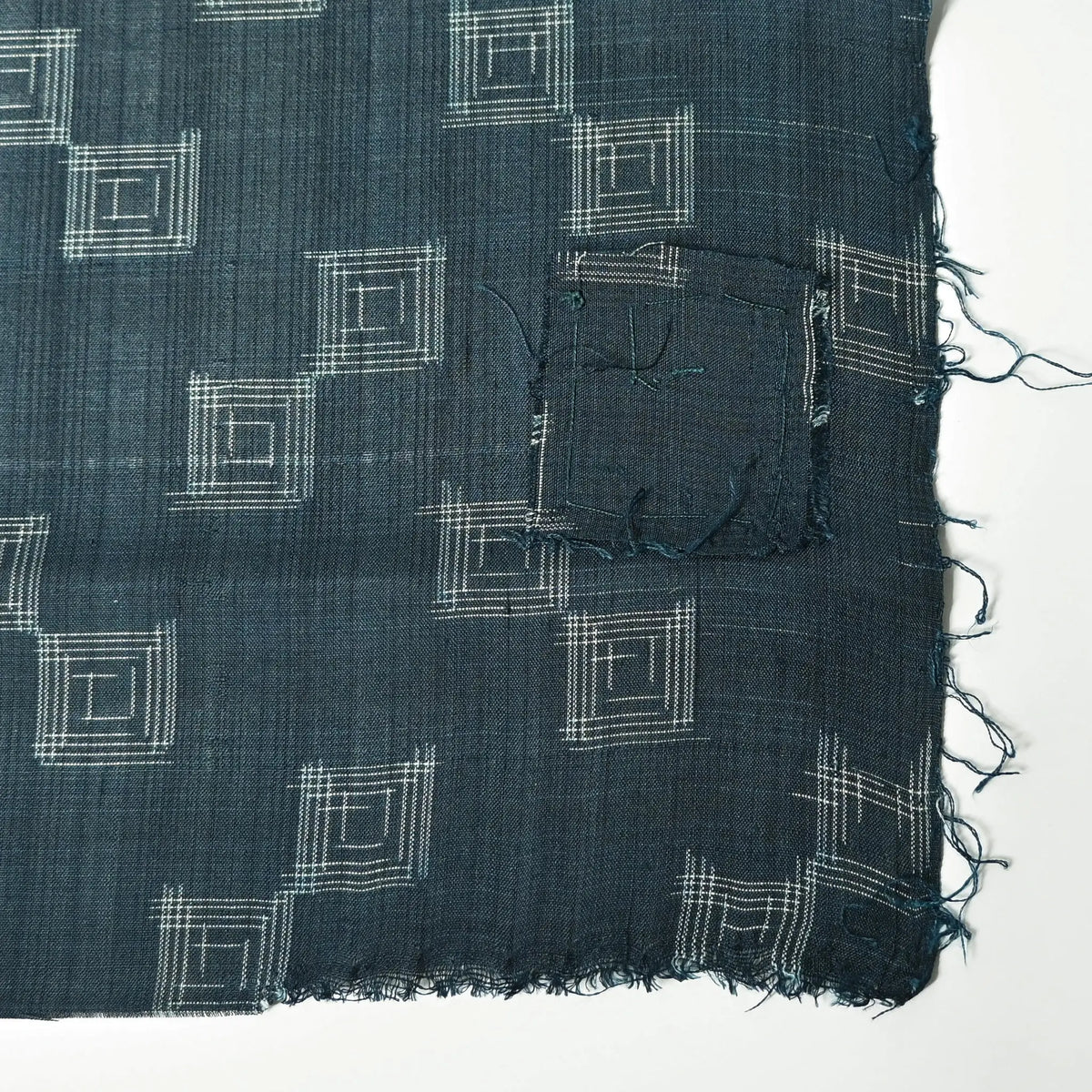 Vintage fine silk kimono fabric piece in dark emerald green with simple square pattern has a charming patch.
