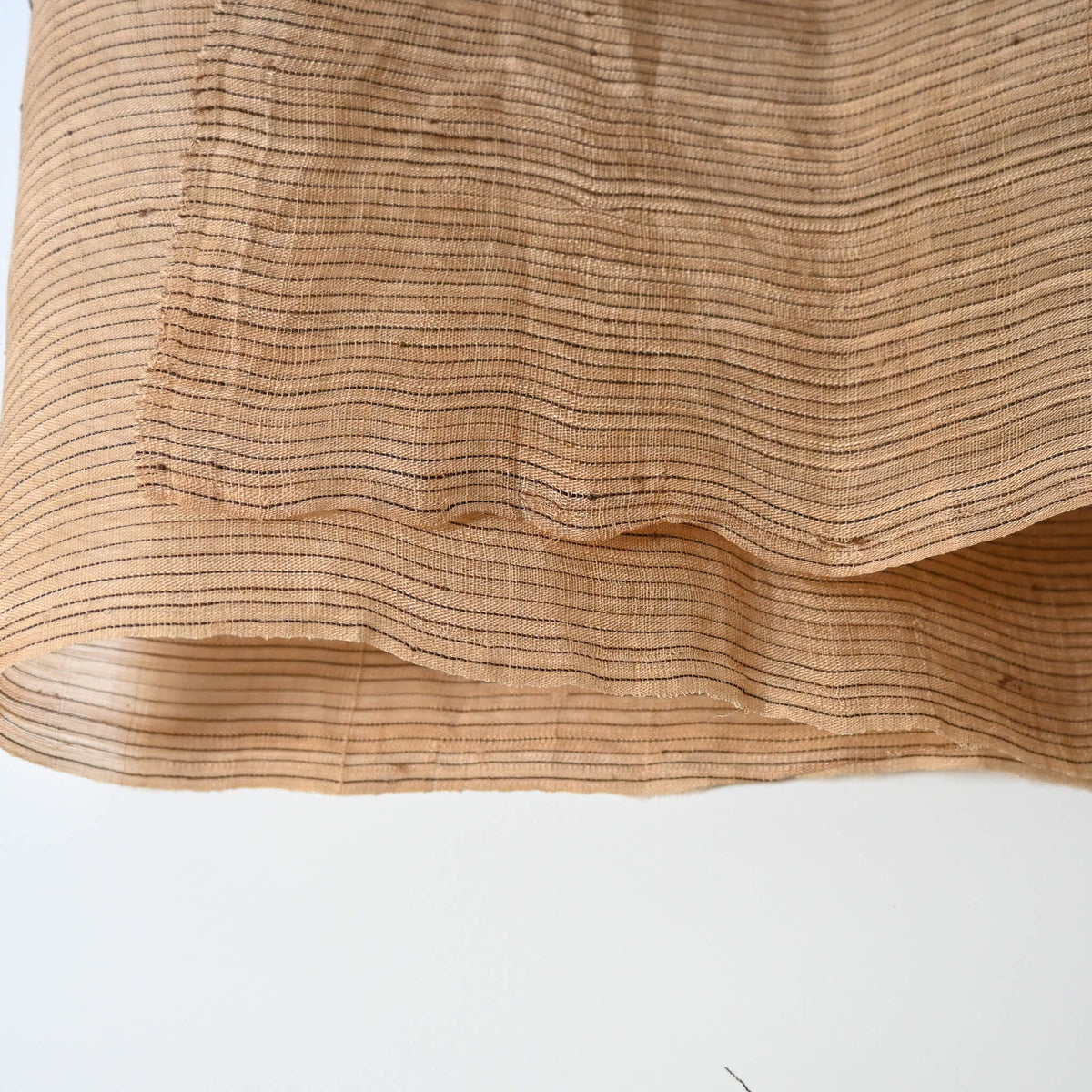 Close-up view of vintage collectable bashofu banana fibre textile, natural fine stripe pattern.