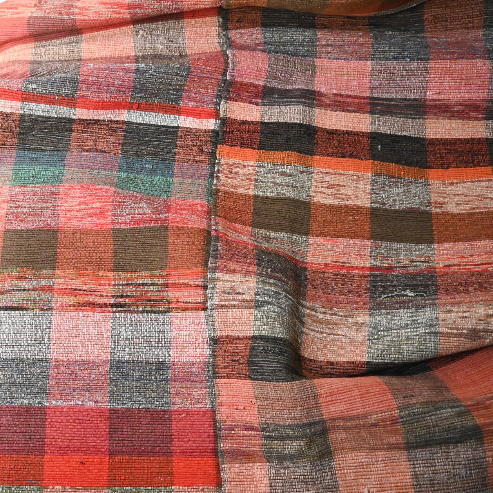Close-upl view of vintage Japanese five-panel Sakiori rag-weaving textile made from recycled old kimono and futon fabrics. 