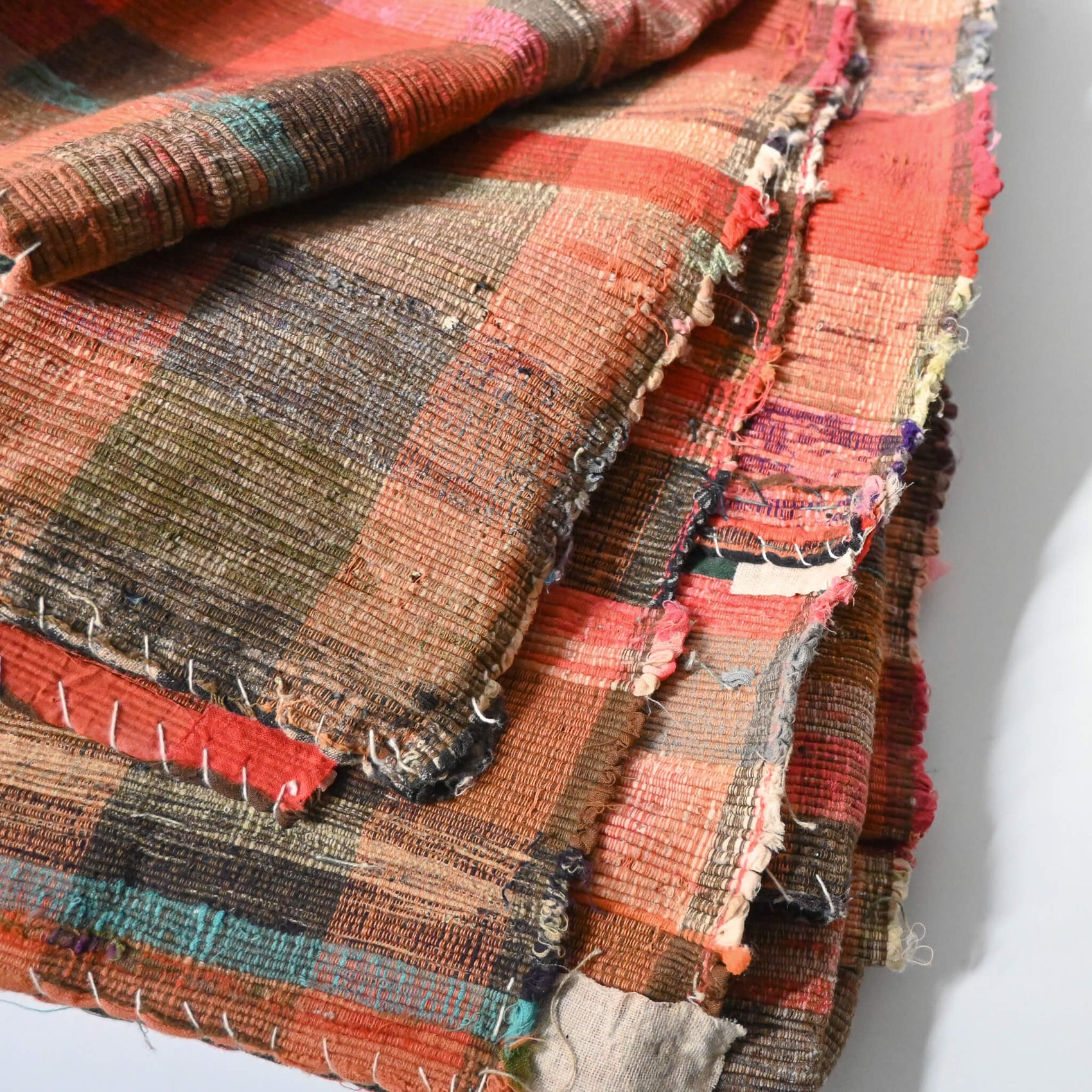 Close-upl view of vintage Japanese five-panel Sakiori rag-weaving textile made from recycled old kimono and futon fabrics. 