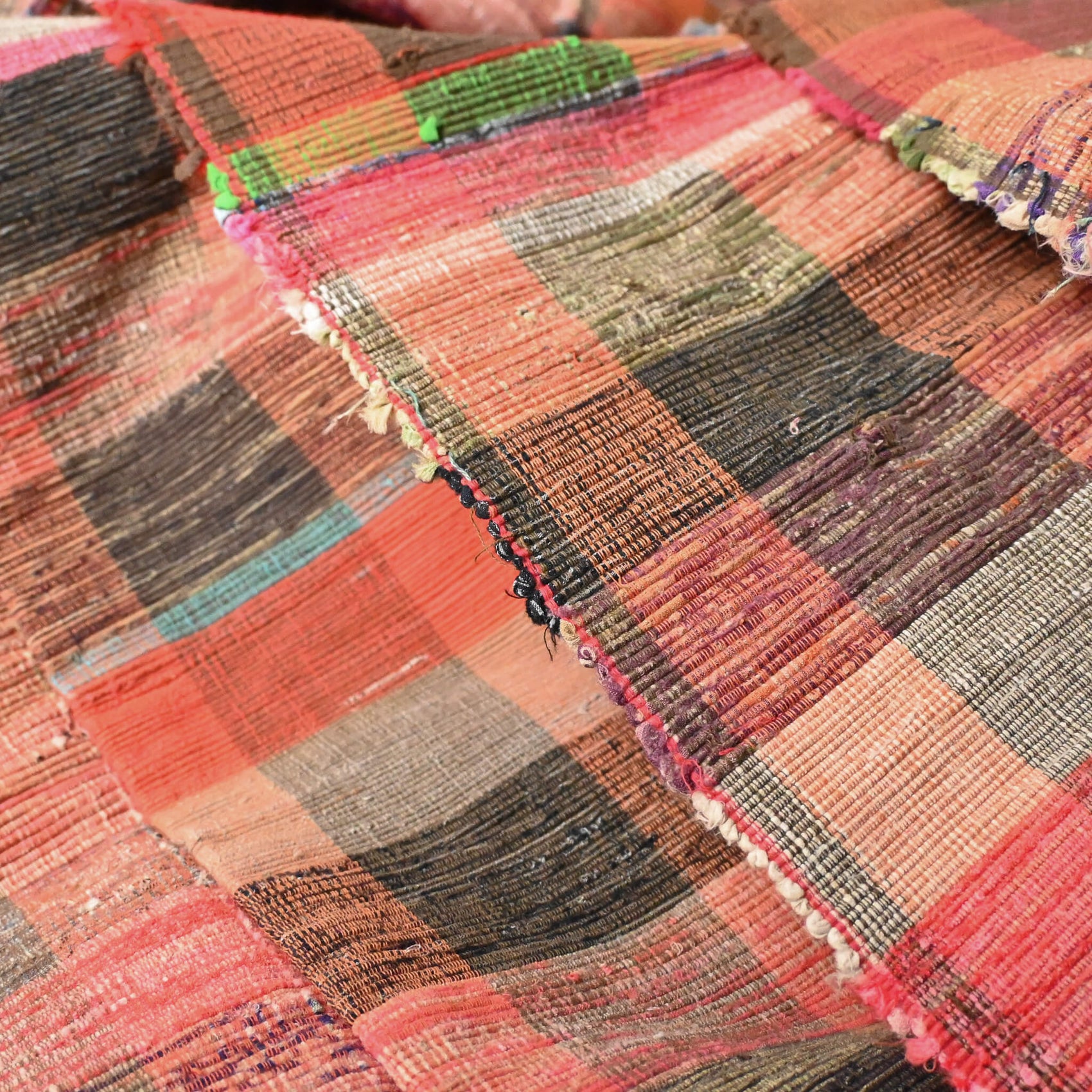 Close-upl view of vintage Japanese five-panel Sakiori rag-weaving textile made from recycled old kimono and futon fabrics. 