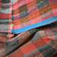 Close-upl view of vintage Japanese five-panel Sakiori rag-weaving textile made from recycled old kimono and futon fabrics. 