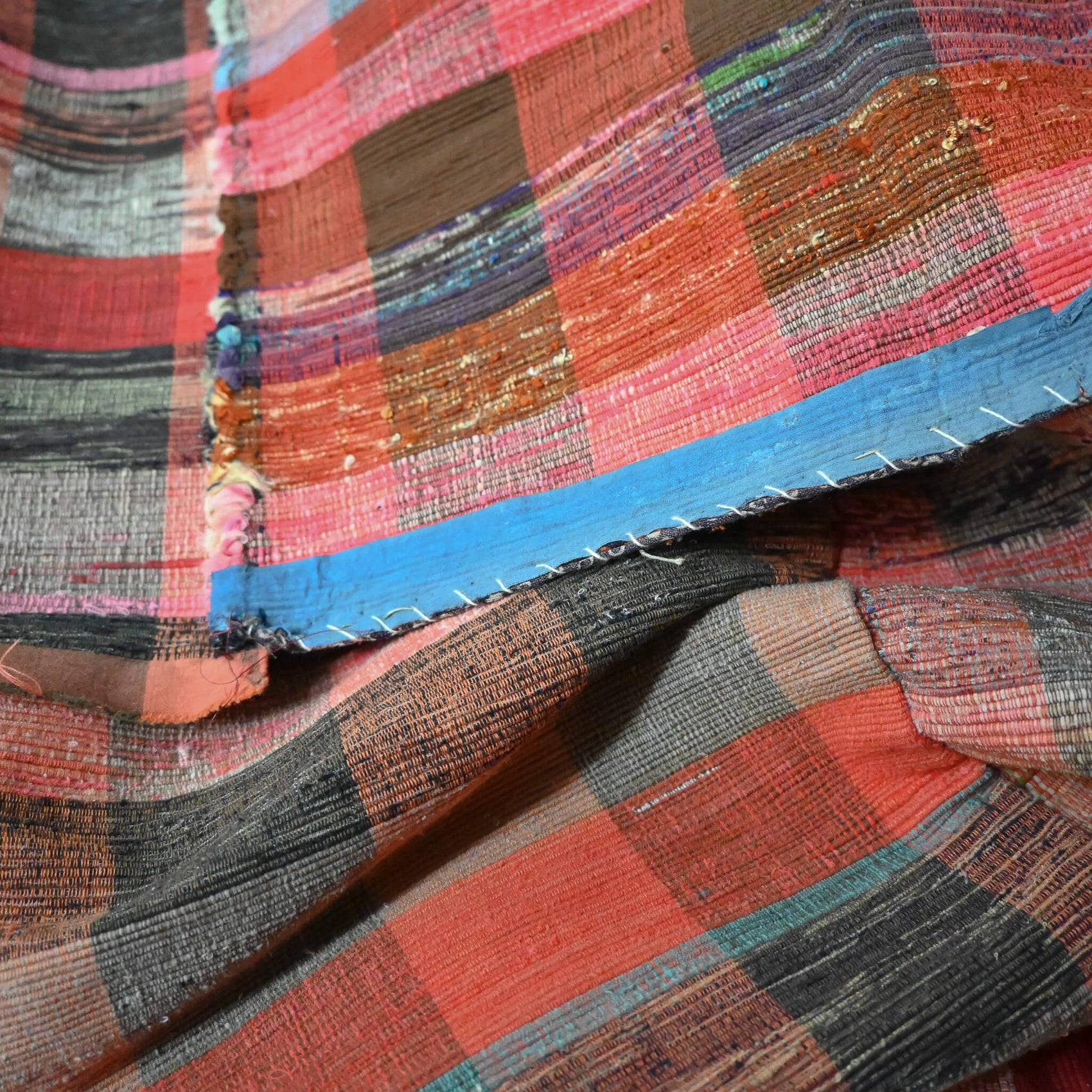 Close-upl view of vintage Japanese five-panel Sakiori rag-weaving textile made from recycled old kimono and futon fabrics. 