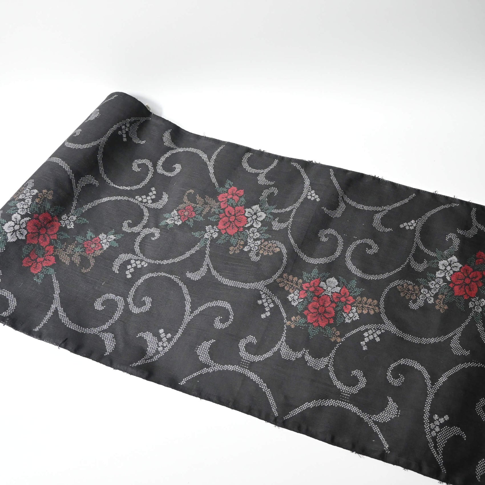 Full view of vintage flora Oshima tsumugi silk kimono fabric sold by the metre.