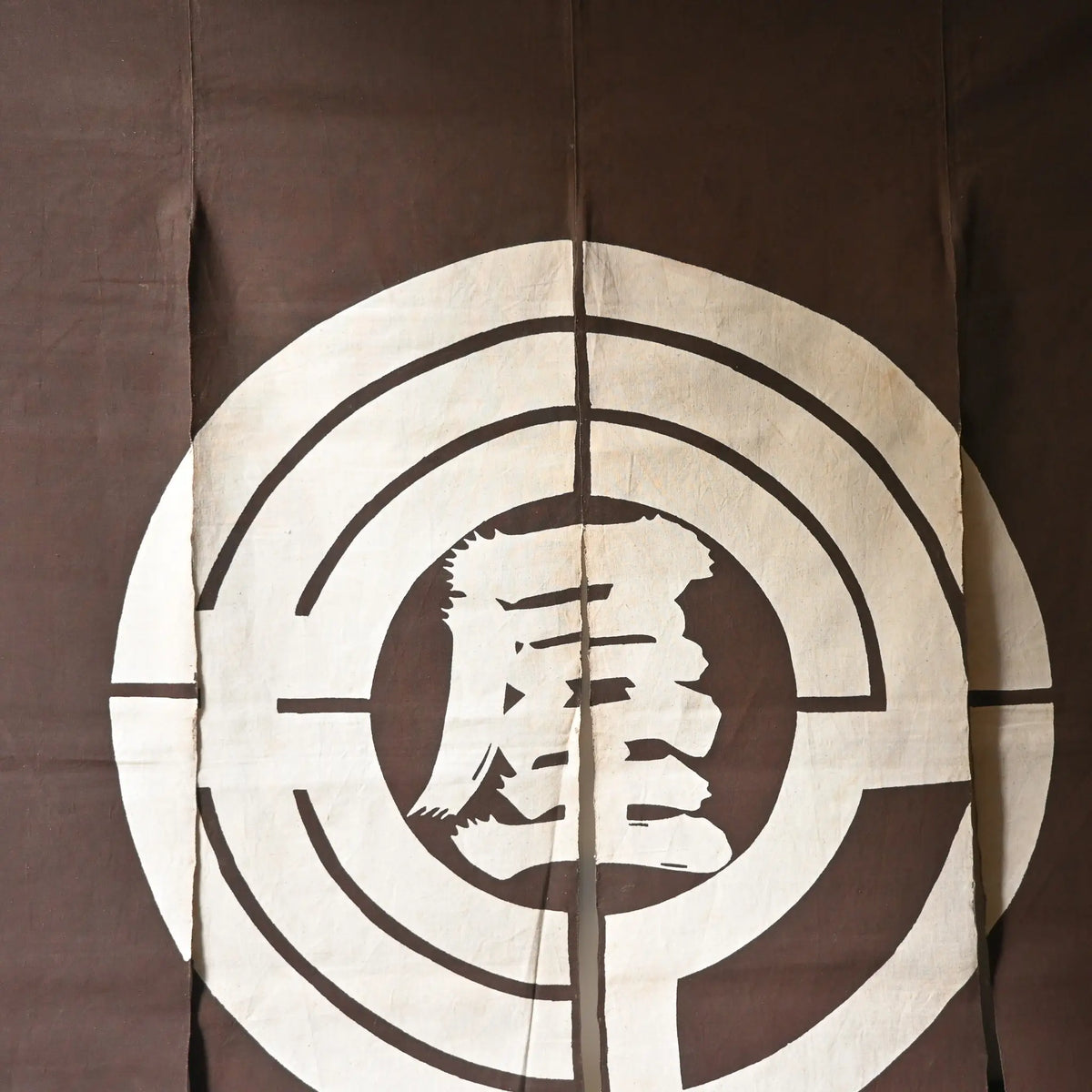 Vintage four-panel brown cotton shop noren with a bold logo from mid-20th Century.
