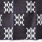 Detailed view of vintage four-panel indigo egasuri cotton futon cover.