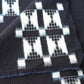 Detailed view of vintage four-panel indigo egasuri cotton futon cover.