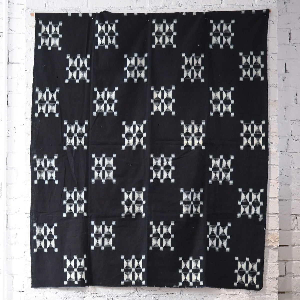 Full view of vintage four-panel indigo egasuri cotton futon cover.