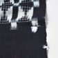 Detailed view of vintage four-panel indigo egasuri cotton futon cover, some holes.